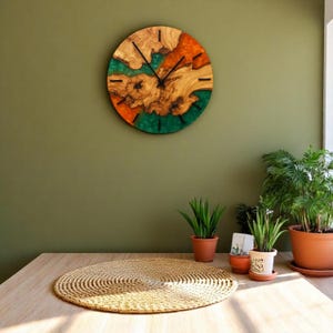 Eco-friendly olive wood and resin clock perfect for home decor.