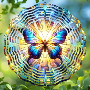 May include: A colorful metal wind spinner with a stained glass butterfly design. The butterfly has blue, yellow, and purple wings with a galaxy-like pattern. The wind spinner has a circular shape with multiple layers of metal.