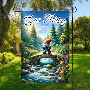 May include: A garden flag with a whimsical illustration of a gnome fishing on a stone bridge over a stream. The flag has a blue background with the text "Gone Fishing" in white cursive lettering.