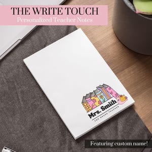 May include: White notepad with a colourful illustration of a stack of books with a snail on top. The text "Mrs. Smith 2nd Grade Teacher" is below the illustration. The text "The Write Touch Personalised Teacher Notes Featuring custom name!" is at the top and bottom of the image.