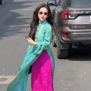 May include: A set of three ceramic mugs with a speckled, matte finish. The mugs are in shades of cream, light gray, and dark gray. Each mug has a simple, modern design and a rounded handle. The mugs are stacked on top of each other.