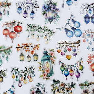 May include: A collection of watercolor stickers featuring various lanterns, string lights, and hanging decorations. The stickers showcase a variety of colors, including blue, red, orange, and green, with floral accents and decorative elements.