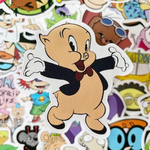 May include: A cartoon sticker of a pig wearing a tuxedo and a bow tie. The pig is standing on its hind legs with its arms outstretched. The sticker is white with a black outline.