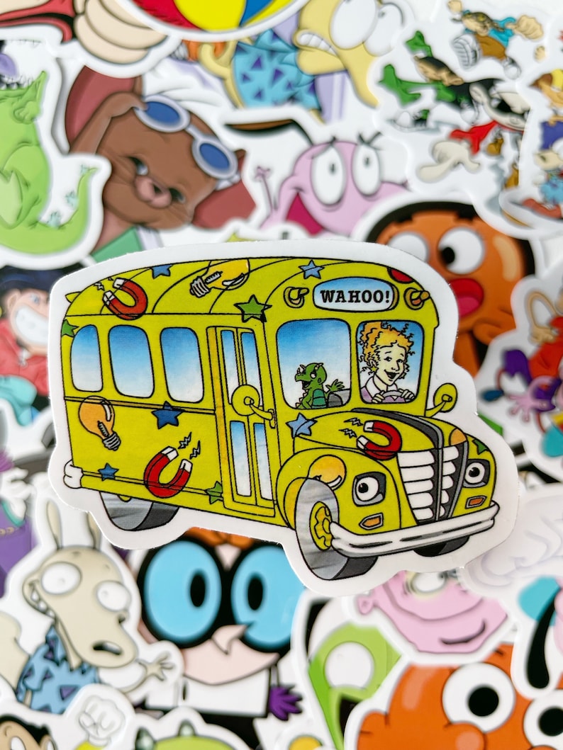 May include: A yellow school bus sticker with a cartoon driver, stars, light bulbs, and magnets. The bus has the word "WAHOO!" on the side.