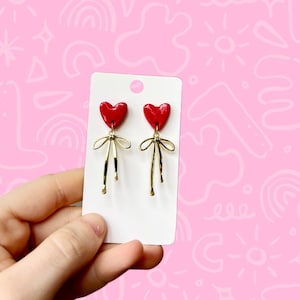Red heart earrings with gold bows