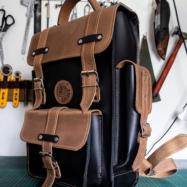 Leather backpack model "CANI" handmade with side pockets.