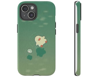 May include: Green phone case featuring a cartoon duck and frog floating in water. The case has a gradient green background and black side buttons. The design is whimsical and playful, perfect for anyone who loves cute illustrations.