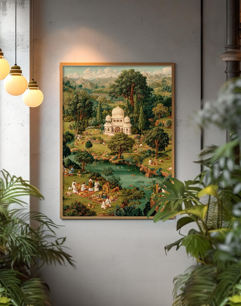 May include: A framed print depicts a serene landscape with a white domed building, a lake, and figures picnicking. Lush green trees and rolling hills fill the background. The artwork is encased in a gold-toned frame, creating a classic aesthetic.