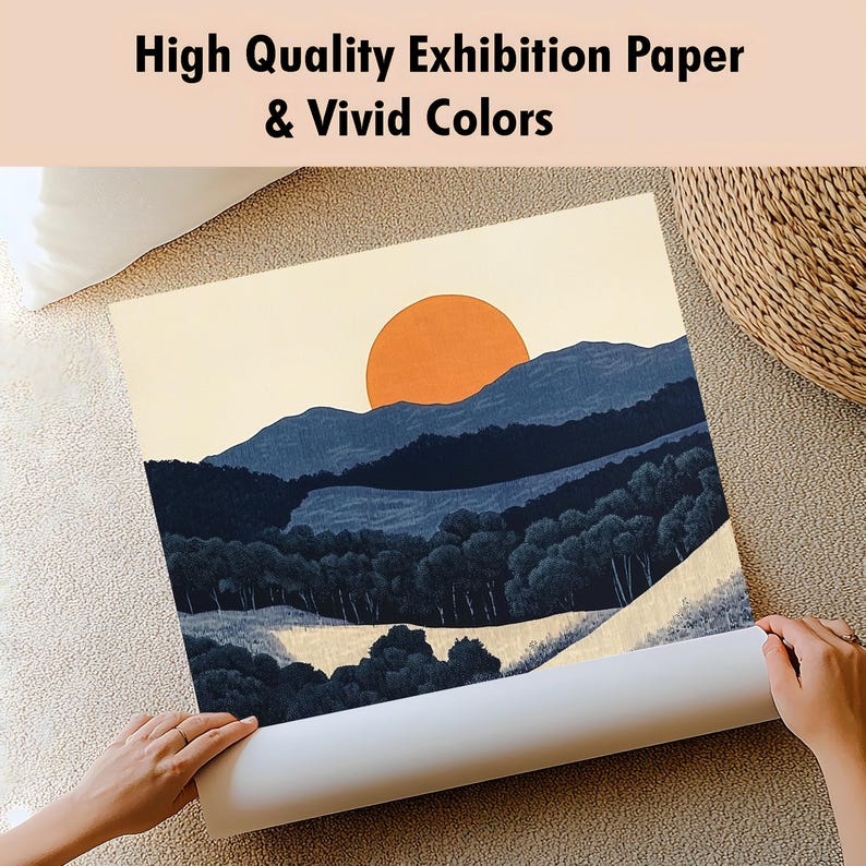 May include: A rolled print of a landscape painting featuring a large orange sun, blue mountains, and dark green trees. The text at the top reads "High Quality Exhibition Paper & Vivid Colors."