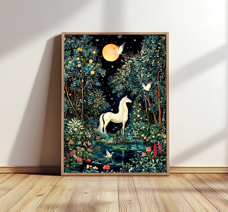 May include: A framed wall art print featuring a white unicorn standing in a dark forest at night. A large yellow moon hangs in the sky above, surrounded by stars. White birds fly through the trees, and a small pond with water lilies sits below.
