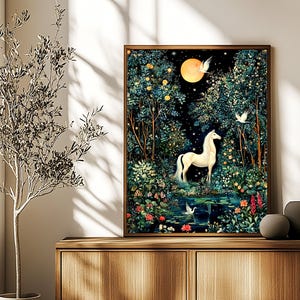 May include: A framed rectangular wall art print featuring a white horse standing in a dark, lush forest at night. A bright yellow full moon illuminates the scene, surrounded by dense trees, colorful flowers, and a small pond with white birds.