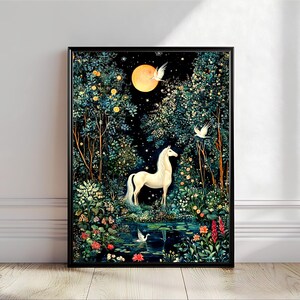 May include: A framed wall art print featuring a white unicorn standing in a dark, lush forest at night. A large yellow moon hangs in the sky above, surrounded by stars. White birds fly through the trees, and a small pond sits in the foreground.