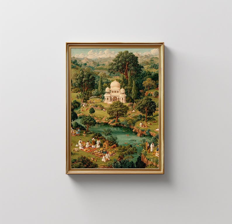May include: A framed print depicting a serene landscape with a white domed building, lush greenery, and a flowing river. The artwork features figures in white clothing, suggesting a picnic or gathering. The frame is gold-colored, adding a touch of elegance.