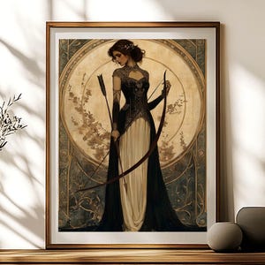May include: A woman in a black and white dress holds a bow and arrow. She is standing in front of a circular design with floral accents. The background is a light brown color.