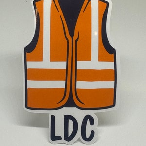 May include: Orange safety vest with white reflective stripes and the text "LDC" printed below.
