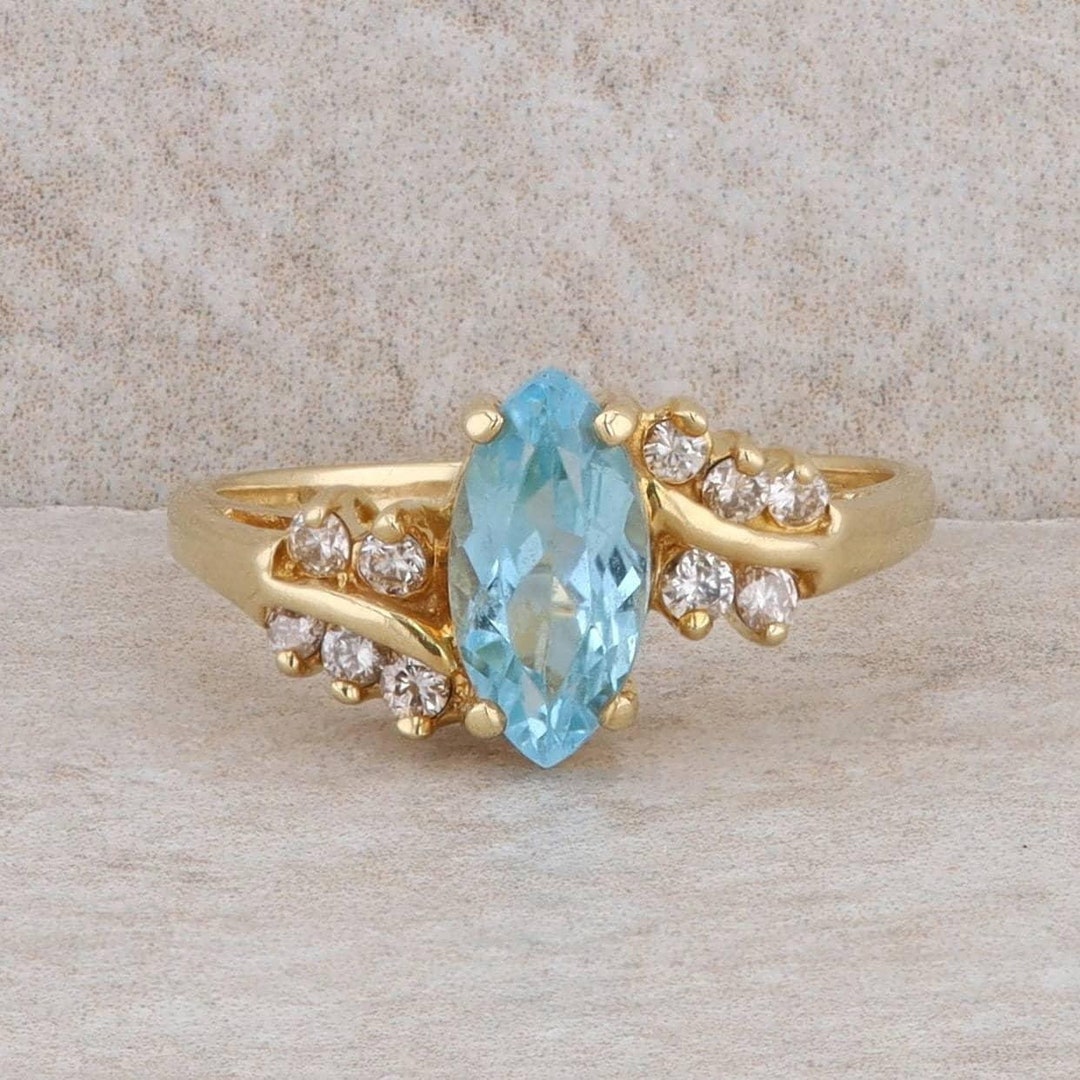14kt Yellow Gold Station Swiss Blue Topaz and .24pts Diamond Ring main image 1