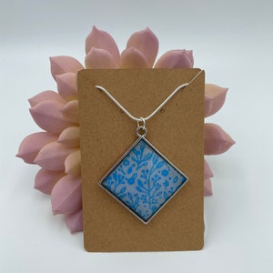 Blue floral pendant with silver chain