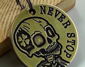 Brass Four-Leaf Clover Keychain: &quot;Never Stop&quot; Skeleton Talisman