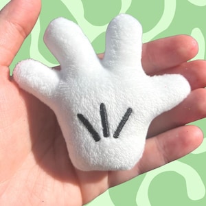 May include: A set of three ceramic mugs with a speckled, matte finish. The mugs are in shades of cream, light gray, and dark gray. Each mug has a simple, minimalist design, perfect for coffee or tea.