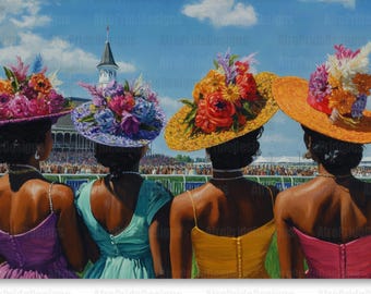 May include: Four women wearing colorful hats and dresses stand in front of a crowd at a racetrack. The women are looking towards the racetrack, and the hats are decorated with flowers.