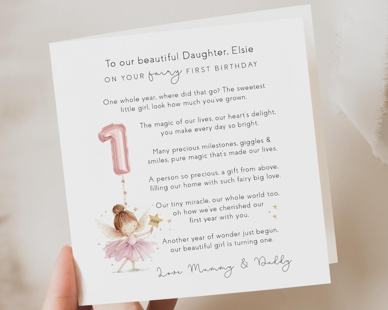 May include: A white birthday card with a poem and illustration. The card is addressed to Elsie and celebrates her first birthday. A pink number one balloon and a fairy are illustrated on the card.