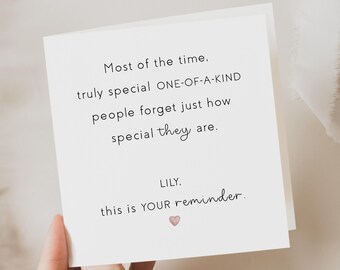 May include: A white greeting card with black text that reads "Most of the time, truly special ONE-OF-A-KIND people forget just how special they are. LILY. this is YOUR reminder." A small pink heart is at the bottom.