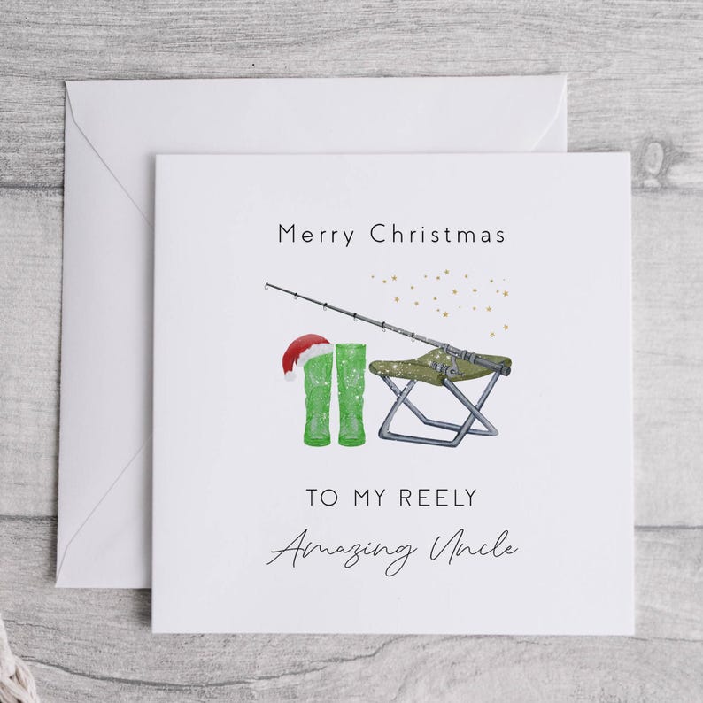 May include: A white Christmas card with a green fishing boot, a fishing rod, and a folding chair. The card says "Merry Christmas to my Reely Amazing Uncle".