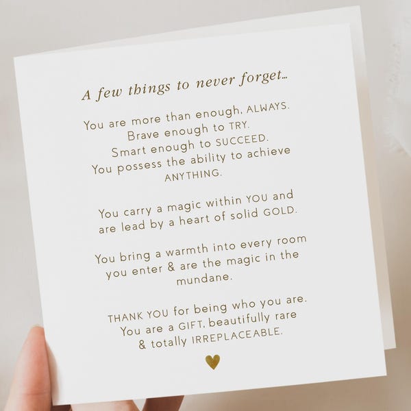 May include: A cream-colored greeting card with gold text that reads "A few things to never forget..." followed by an inspirational message. A small gold heart is at the bottom of the card.