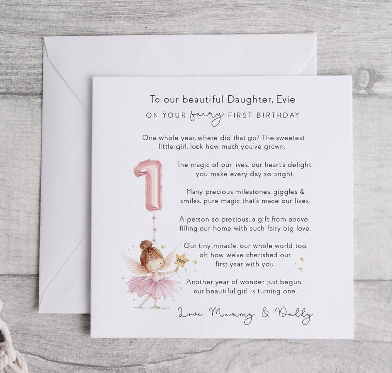 May include: A first birthday card for a daughter, featuring a pink number one balloon and a fairy illustration. The card includes the text: "To our beautiful Daughter, Evie, on your fairy first birthday."