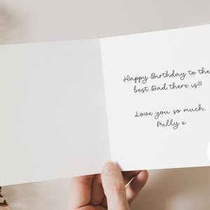 May include: A white greeting card with the message "Happy Birthday to the best Dad there is!!! Love you so much, Milly x." The card also has an option to add a personal message inside.