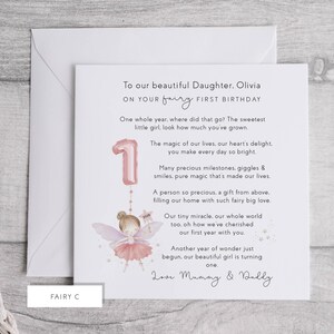 May include: A birthday card featuring a pink number one balloon and a fairy illustration. The card is addressed to Olivia and reads "To our beautiful Daughter, on your fairy first birthday." The card is in a white envelope.