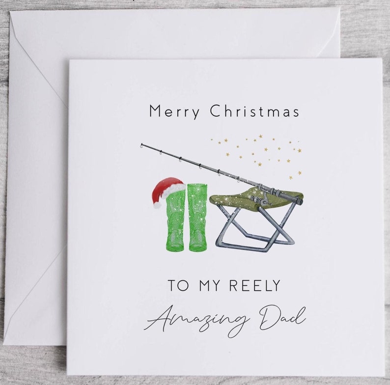 May include: A Christmas card with a green fishing boot wearing a Santa hat, a fishing rod, a folding chair, and the text "Merry Christmas to my Reely Amazing Dad".