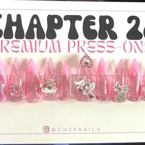Pink glittered out press on nails| pink French tip nails| blingy nails| pink glitter nails|nails with charms| nail gifts for her| stiletto