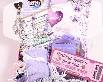 May include: A purple-themed gift box filled with fantasy-themed items. Includes a sticker with a dragon, a keychain, a book, a pair of socks, and a ticket that reads "Fantasy Lover's Book Club".