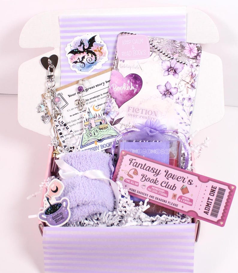 Blind Date with a Kindle mystery book box styled for booktok readers featuring kindle insert for clear case, cute kindle charm keychain, kindle dust plug charm, and decorative kindle stickers. Includes cozy reading items and aesthetic kindle accessories perfect for customizing a kindle paperwhite, kindle oasis, kindle scribe, or ereader case with personalized kindle decorations and booklover gifts.