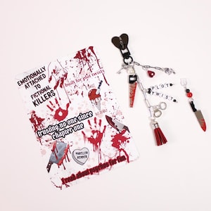 Kindle paperwhite styled inside a clear kindle case showing decorative watercolor kindle insert paired with kindle charm keychain and dust plug charm. This kindle accessories bundle includes kindle stickers and cozy reading items that help readers personalize their ereader case, kindle cover, or kindle sleeve using kindle inserts, kindle charms, and aesthetic kindle decorating accessories inspired by popular booktok booklover gifts. Thriller Kindle Insert for Thriller book lover.