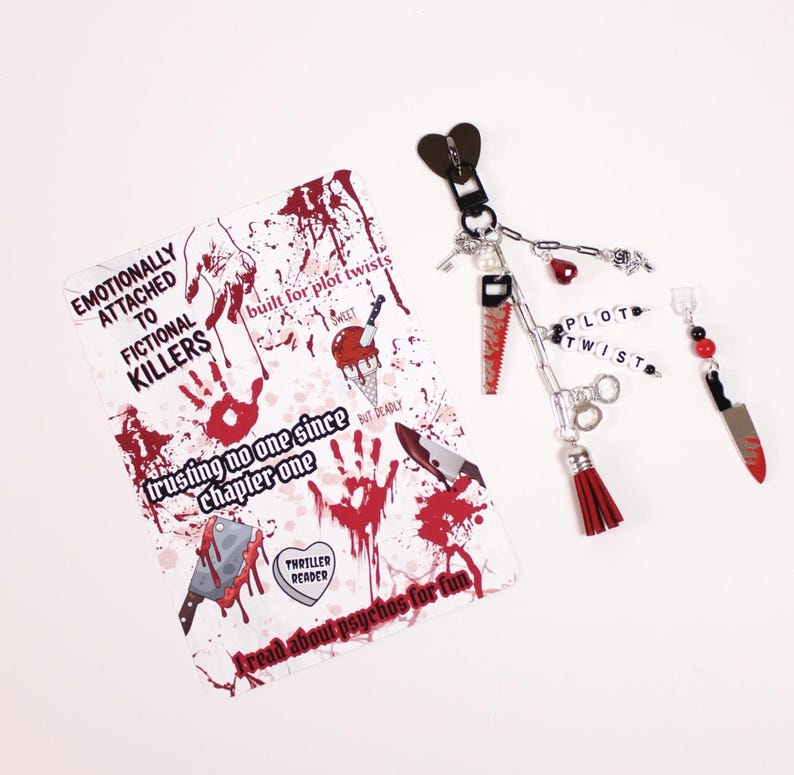 Kindle paperwhite styled inside a clear kindle case showing decorative watercolor kindle insert paired with kindle charm keychain and dust plug charm. This kindle accessories bundle includes kindle stickers and cozy reading items that help readers personalize their ereader case, kindle cover, or kindle sleeve using kindle inserts, kindle charms, and aesthetic kindle decorating accessories inspired by popular booktok booklover gifts. Thriller Kindle Insert for Thriller book lover.