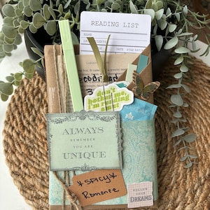 Blind Date with a Book - a delightful mystery book gift for readers, including a new book in genres such as romance, thriller, or fantasy. The book is wrapped with blind date clues, and comes with added extras: herbal tea, bookish stickers, annotation tabs, highlighter, book tracker, and a library-style reading list. A perfect surprise for fans of booktok, spicy romance, dark romance, and those who love the joy of a mystery reading experience.