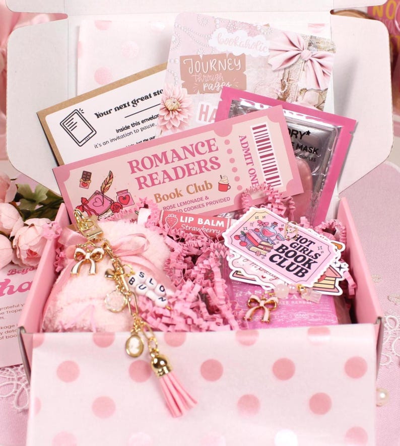 Decorative kindle insert watercolor aesthetic placed behind a kindle clear case with cute kindle charm keychain and dust plug charm. Styled with kindle stickers and cozy reading accessories, this blind date with a kindle gift set is perfect for readers personalizing their kindle paperwhite, kindle oasis, kindle scribe, or ereader case with aesthetic kindle decorations.
