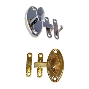 May include: Two sets of door latches. One set is polished chrome with a hook and eye design. The other set is polished brass with a hook and eye design.