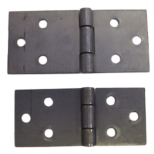 May include: Two pairs of black metal hinges with four holes on each side. The hinges are closed and ready to be installed.