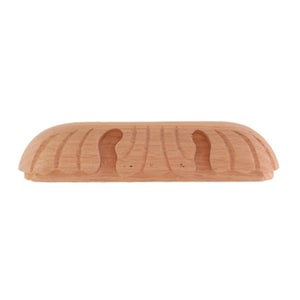 May include: A wooden drawer pull with a carved design. The pull is light brown and has a rounded shape.
