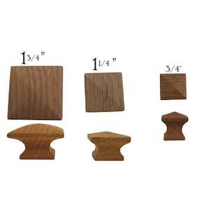 May include: Assortment of wooden cabinet knobs in three sizes: 1 3/4", 1 1/4", and 3/4". The knobs are square with a pyramid-shaped top and are available in a traditional style with a base.