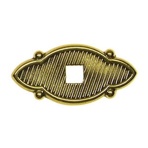 May include: A gold-toned metal escutcheon with a decorative, ribbed design and a square keyhole in the center.