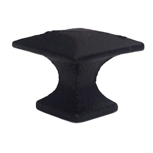 May include: Black square cabinet knob with a square base. The knob has a textured surface.