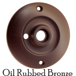 May include: Oil rubbed bronze door knob backplate with three screw holes.