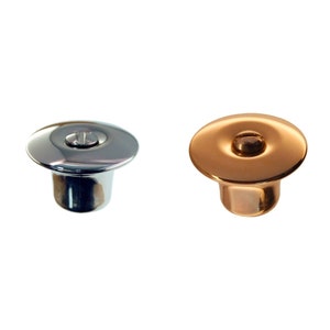 May include: Two metal push buttons, one silver and one gold. Both have a raised center with a screw in the middle.