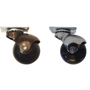 May include: Two swivel casters with black rubber wheels. One caster has a brass finish and the other has a chrome finish.
