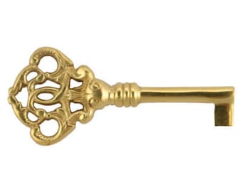 May include: An ornate gold-toned key with a decorative head and a long, straight shaft.