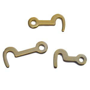 May include: Three gold-colored metal hooks with a loop at one end. The hooks are designed to be used as a latch or fastener.